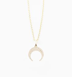 Made for forever, the 24/7 solid gold necklace you'll never take off. This necklace is tarnish free and will not irritate your skin, so you can wear this piece all day everyday without a worry. 
A classic moon pendant with diamond studs to make it shimmer. In 14k gold with diamond accents this piece is made to wear everyday. Fine Jewelry Diamond Moon Phase, Diamond Necklace With Moon Charm For Anniversary, Fine Diamond Moon Shaped Jewelry, Diamond Moon Charm Necklace With Round Pendant, Fine Jewelry Diamond Moon Phase Necklaces, Fine Jewelry Moon-shaped With Diamond Accents, Fine Jewelry Moon Shaped With Diamond Accents, Diamond Moon Phase Round Pendant Jewelry, Crescent Diamond Necklace Gift