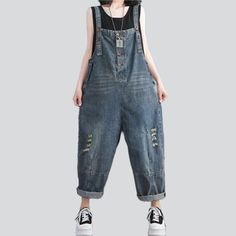 Revamp your style this summer with our vintage-inspired whiskered women's denim jumpsuit from the 2023 Spring-Summer Collection. With a baggy fit. bold suspenders closure. and distressed detailing. this jumpsuit will make you stand out from the crowd.Why They're Your Next Summer Staple Vintage-Inspired Design: A perfect combination of vintage charm and contemporary style. this jumpsuit will make you look effortlessly stylish. Whiskered Detailing: Subtle whiskered detailing on the front and back Womens Denim Jumpsuit, Jeans Street Style, Jeans Overall, Classic American Style, Jumpsuit Online, Street Style Trends, Modern Trend, Vintage Inspired Design, Denim Design