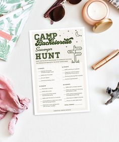 a camp brochure sitting on top of a table next to sunglasses and other items