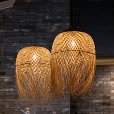 two hanging lights made out of bamboo sticks