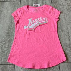 Justice Round Neck Short Sleeves With Justice Print For Girls Size 10,Pink 60% Cotton, 40% Polyester Turn Inside Out Machine Wash Cold With Like Colors Only Nonchlorine Bleach Why Tumble Dry Low Warm Iron On Reverse If Needed Do Not Iron On Decoration Pink Tops For Playwear In Spring, Pink Letter Print Tops For Playwear, Cute Pink Tops For Playwear, Pink T-shirt For Playwear In Spring, Pink T-shirt For Spring Playwear, Spring Pink T-shirt For Playwear, Pink Short Sleeve Tops For Playwear, Spring List, Justice Clothes