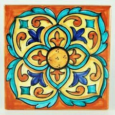 an orange, blue and yellow tile with designs on it