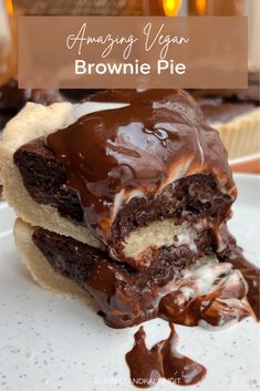 two pieces of chocolate covered brownie pie on a white plate with text overlay reading amazing vegan brownie pie