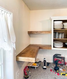 a kitchen counter with tools and other items on it