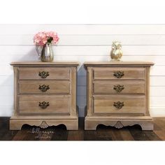 two wooden nightstands side by side with flowers on top