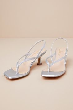 The Lulus Lavonna Silver Thong Slingback Kitten Heel Sandals are the perfect go-to look for all of your date night 'fits! Smooth faux leather shapes these flirty sandals with a square footbed and a thong upper that leads to a slingback-style strap (with a bit of elastic at the back). The single sole silhouette sits atop a chic, sculpted kitten heel. 2. 5" wrapped spool heel. Cushioned insole. Rubber sole has nonskid markings. Man made materials. Imported. Lulus | Lavonna Silver Thong Slingback K Night Fits, Resort Wear Beach, Work Fits, Kitten Heel Sandals, Spool Heel, Sandal Heels, Casual Wedding Dress, Heel Sandal, Slingback Sandal