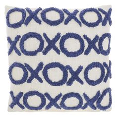 a blue and white pillow with circles on it