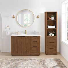 a bathroom with a sink, mirror and shelving unit next to a rug on the floor