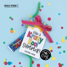 a kid's kooly summer book with a ribbon tied around it and some confetti on the side