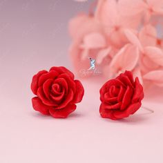 These elegant resin rose flower stud earrings feature a beautiful rose design in white or red color, complete with a sterling silver needle and back. Perfect for weddings and as a luxurious gift, these earrings can also elevate any outfit for daily wear. Enhance any outfit and feel truly elegant with these stunning resin rose flower stud earrings! Available in both white and red, their captivating rose design and high-quality sterling silver needle and back make them a luxurious addition to your daily wardrobe. Perfect for weddings or as a thoughtful gift, these earrings will surely make a statement and leave a lasting impression. Add a touch of beauty and sophistication to your style with these exquisite studs. Materials: 925 sterling silver, resinDiameter: 0.79 in Jewelry Care: See more Formal Rose Earrings With Rose Design, Formal Rose-design Rose Earrings, Flower Shaped Rose Earrings For Gift, Rose Flower Earrings For Gift, Rose Red Flower Earrings With Rose Design, Flower Shaped Rose Design Party Earrings, Rose Design Flower Earrings For Formal Occasions, Rose Design Flower Earrings For Anniversary, Formal Rose Design Earrings