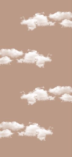 the sky is filled with white clouds on a brown background