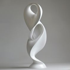 a white sculpture is shown on a gray background