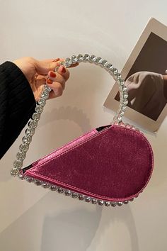 This heart-shaped diamond clutch embodies the perfect fusion of beauty and sophistication. Its dazzling elements make a statement wherever you go. Crafted with high-quality materials, this diamond clutch enhances your allure and adds a touch of glamour to any occasion. Elevate your style and captivate the crowd with this luxurious accessory. Perfect for romantic dates, gala events, or even a night out with friends, this heart-shaped diamond clutch is a versatile companion that complements your o Heart-shaped Evening Bag For Wedding, Trendy Evening Bag For Valentine's Day, Chic Crystal Clutch For Party, Glamorous Heart-shaped Evening Bag, Valentine's Day Heart-shaped Party Bag, Trendy Heart-shaped Evening Bags, Elegant Heart-shaped Evening Bag For Events, Elegant Heart-shaped Evening Bag, Pink Heart-shaped Bag For Party