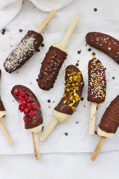 chocolate covered ice cream and sprinkles on sticks