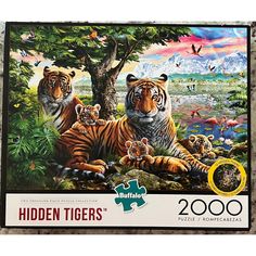 a jigsaw puzzle with two tigers in the forest