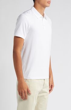 This polished take on the polo is crafted from lightweight lyocell jersey with added stretch to retain its shape. 26" length (size medium) Button half-placket Spread collar Short sleeves 93% Tencel® lyocell, 7% spandex Tencel lyocell is a sustainably produced fiber made with closed-loop processing Dry clean or machine wash, tumble dry Imported Casual Stretch Polo Shirt For Work, Casual White Stretch Polo Shirt, White Casual Polo Shirt With 4-way Stretch, White Casual Polo Shirt With Seamless Collar, Fitted Collared Golf Polo Shirt, Casual White Polo Shirt With Seamless Collar, Fitted Collared Polo Shirt For Golf, Casual Stretch Polo Shirt For Golf, Classic Stretch Polo Shirt