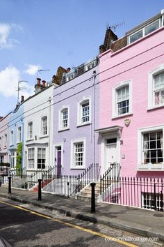 several different colored houses line the street