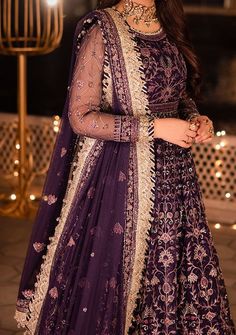 Introducing our New collection 'Chandni Raatein' by Asim Jofa designed to make you look and feel your best. Swathed in the mystique of twilight, this dress is a purple dream woven into existence. Champagne gold zari, like sunbeams kissing a lavender sky, are studded with stardust-like sequins. Threads in mauve and deep purple hues dance in harmony, creating a masterpiece of color. The embroidered dupatta, a wispy cloud of enchantment, finishes this ensemble with the grace of a fairytale ending. Embroidered Front and Back Bodice With Bodice Hem on Net Embroidered Kalis for Peshwas on Net Embroidered Border for Hemline of Peshwas on Net Embroidered Sleeves With Border on Net Embroidered Dupatta on Net With 4 Side Borders Color: There might be slight color variation due to lighting and flashe Velvet Anarkali, Net Anarkali, Batik Print Dress, Lavender Sky, Salwar Suits Party Wear, Indian Anarkali, Lehenga Jewellery, Side Borders, Saree Sale