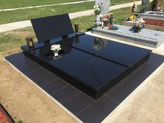 a large black table sitting in the middle of a cemetery