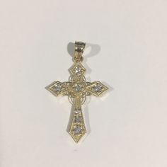 Beautiful 14k Yellow Gold Cross Pendant With Cz Stones . Weight: 1.8g. Length: 1.30" With Bail. Width: 0.75". New Without Tags!!! 14k Gold Cross Jewelry With Diamond Accents, Yellow Gold Cubic Zirconia Cross Jewelry, Diamond-shaped Jewelry With Pave Setting As Gift, Yellow Gold Cubic Zirconia Cross Pendant, Yellow Gold Cross Pendant With Diamond Accents, Yellow Gold Cross Pendant Jewelry With Diamond Accents, Cubic Zirconia Cross Pendant With Pave Setting, Yellow Gold Diamond Cross Pendant Jewelry, Gold Cubic Zirconia Diamond-shaped Jewelry