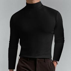 Product Highlights: Introducing our Men's Casual Solid Color Fitted High Neck Long Sleeve T-Shirt, a modern and versatile piece for your wardrobe. This stylish and comfortable t-shirt is designed to elevate your casual look and provide a flattering fit. Cut: The t-shirt features a fitted cut, contouring to your body shape for a sleek and modern silhouette. Collar: The high neck collar adds a trendy and stylish element to the t-shirt, creating a standout look compared to regular crew neck tees. S Casual Black Turtleneck T-shirt, Black Slim Fit Crew Neck T-shirt, Fitted Cotton Turtleneck T-shirt, Black Turtleneck T-shirt, Solid Slim Fit Crew Neck T-shirt, Black Cotton Turtleneck Top, Black Slim Fit Crew Neck Tops, Slim Fit Crew Neck Tops For Winter, Slim Fit Plain Cotton Tops