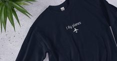 All our products are custom made and we are excited to embroider the hoodie for you! This sweatshirt is perfect for the aviation lover in your life, whether that be a pilot, a student in flight school, or someone who just loves planes! ♡ SWEATSHIRT DETAILS ♡  .: Unisex .: Loose fit, size chart included in photos .: Design is embroidered .: 50% Cotton; 50% Polyester (fibre content may vary for different colors) .: Medium fabric (8.0 oz/yd² (271.25 g/m .: Sewn in label .: Runs true to size 💕 THAN Pilots Birthday, Fly Plane, Pilots Aviation, Plane And Pilot, Embroidered Crewneck, Sweater Gift, Sew-in Labels, Size Chart, Sweat Shirt