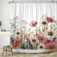 the shower curtain is decorated with colorful flowers