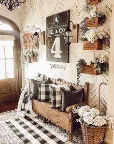 a living room filled with lots of furniture next to a wall covered in plants and flowers