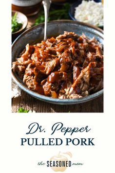 a bowl full of pulled pork with sauce on it and the title dr pepper pulled pork