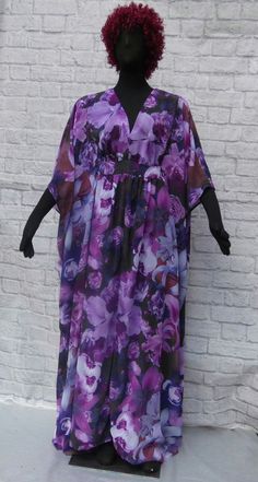 This ankle length caftan/housedress echoes classic vintage 1970's cover-ups. Beautiful and varied burgundy and purple flowers grace a tonal purple ground. The v-shaped neckline yoke  and the luxurious  skirt are gathered at the midriff which is secured by inside ties. A hand threaded button loop and a vintage button secure the back closure. Vintage button may vary depending on availability. The 100% polyester caftan fabric  allows maximum comfort, flow and style. Size Large : bust = 40-42 inches Floral Print Flowy Maxi Cover-up, Flowy Floral Print Beach Dress For Festival, Bohemian Flowy Beach Dress For Daywear, Flowy Floral Beach Dress For Festival, Free Size Purple Maxi Kaftan, Spring Floral Print Hippie Kaftan, Floral Print Maxi Dress Beach Cover-up, Hippie Floral Print Maxi Dress For Beach, Floral Print Long Maxi Dress As Beach Cover-up