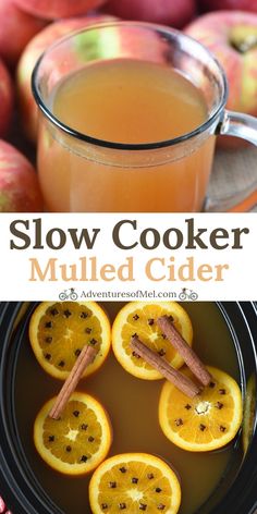 an apple cider with cinnamon sticks and sliced oranges in the background, and text overlay that reads slow cooker mulled cider