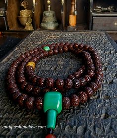 ◇ Treasures, Antique Artefacts from the Himalayas ◇Embrace the spiritual power of Rudraksha  ◇ great patina and colour ◇ Complete 108 beads ◇ 9mm beads ◇ Decades old    Significance of Rudraksha: ◇Rudraksha beads are revered for their spiritual and healing properties. ◇They are believed to enhance meditation, purify the mind, and promote inner harmony. ◇The natural energy of Rudraksha is thought to shield the wearer from negative energies, fostering a sense of protection and balance. Order Now: Traditional Turquoise Wooden Beads, Traditional Turquoise Beaded Necklace With Wooden Beads, Traditional Turquoise Beaded Necklaces With Wooden Beads, Traditional Handmade Beaded Bracelets For Meditation, Bohemian Beaded Bracelets For Puja, Green Spiritual Beads, 108 Count, Traditional Turquoise Beaded Necklaces For Meditation, Polished Green Beads For Festivals, Green Spiritual Mala With 108 Beads