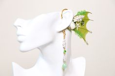 Elven Ear Cuffs - This is a way to look and feel like a Fairy or an Elf! No need for piercing your ears or gluing those latex fake ears on to your skin! 【Please do not use force to bend the earing】Slowly and gently try to slip on the ear. If excessive force is use it can break. *Color is mixed every time an earring is being made. Color might not be exactly as the photo but will try my best to replicate the same exact color Emerald Green color Fin, Shell, Gold mental Bend Cuffs to resize The pend Handmade Fantasy Style Jewelry For Parties, Handmade Fantasy Jewelry For Party, Fairy Style Ear Cuff For Party, Fairy Style Ear Cuff For Party With Pierced Ears, Fantasy Style Single Ear Cuff As Gift, Unique Adjustable Jewelry For Cosplay, Adjustable Fantasy Style Party Ear Cuff, Adjustable Fairycore Jewelry For Parties, Fairycore Jewelry For Parties