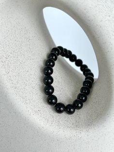 💎 MATERIAL DETAILS ○ 8mm Black Onyx → perseverance, protection, and strength ○ High quality, resistant, and flexible elastic cord (double-corded) 💯 QUALITY & CRAFTSMANSHIP ○ Materials are handpicked, inspected, and handled with the utmost quality and care ○ Double-corded with high quality elastic cord - this means our bracelets have 2x the durability of other stretch bracelets!  ○ Seamless knotting technique which ensures each stretch bracelet knot is concealed ○ Please kindly note natural sto Black Spiritual Bead Bracelet, Spiritual Black Bracelet With 108 Beads, Black Bracelet With 108 Beads, Hand-strung Black Wristband Bracelet, Spiritual Black Beaded Wristband, Spiritual Hand-strung Black Bracelets, Spiritual Black Hand-strung Bracelets, Spiritual Black Hand-strung Wristband, Spiritual Black Hand-strung Bracelet