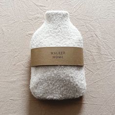 Hand crafted from the plushest boucle wool. Our hot water bottle has a fluffy feel and soft texture. Comes complete with a rubber hot water bottle, Designed to keep you warm and cosy but also make the perfect stylish gift Cover 100% polyester boucle wool  standard size - approx. 39cm x 22cm  Approx. Depth: 4.3cm - 10cm. Our hot water bottles comply with BS 1970:2012 standards. Safety information is included with the product. Please contact us for more information. Hot Water Bottle Instructions Directions of use: Do not use boiling water when filling the hot water bottle. Fill to maximum 2/3 capacity. Hold the bottle by the neck in an upright position and fill slowly to avoid hot water splashing back. Expel air from the bottle by lowering it carefully onto a flat surface until water appears Warm Water Bottle, Hot Water Bottles, Hot Water Bottle Cover, Envelope Design, Hot Water Bottle, Cool Ideas, Beauty Spa, Heat Pack, Dear Santa