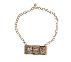 Add a touch of luxury to any occasion with this stunning Dolce & Gabbana gold crystal necklace. Featuring dazzling crystals and an exquisite bow motif inspired by the enchanting beauty of Sicily, this versatile accessory is perfect for adding sophistication to any ensemble. It is adjustable for the perfect fit and crafted in Italy with the brand's renowned attention to detail. Material: 80% Brass, 20% Crystal Color: Gold Crystal: Clear Closure: Lobster clasp Logo detail Country of origin: IT Length: Adjustable up to 48cm Gold Crystal Necklace, Statement Choker, Bow Necklace, Brass Necklace, Dolce E Gabbana, Gold Crystal, Gold Brass, Chain Choker, Delicate Necklace