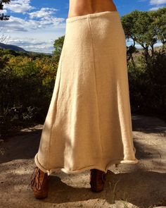 Long knit skirt made out of 100% natural alpaca or organic merino wool. This skirt is wonderful in the cool weather and looks amazing with boots. The skirt provides the perfect warmth. It blocks the wind, and with a pair of alpaca tights or leggings worn beneath, you will stay toasty warm. It is like wrapping a blanket around you, yet you can walk and move with comfort and ease, and you don't have to hold it up with your hands ; ) The A line quality of the skirt allows full range of motion. The Long Knit Skirt, Shopping Link, Natural Clothing, Five Panel, Paneled Skirt, Long Knit, Wool Skirts, Flowy Skirt, Sweater Making