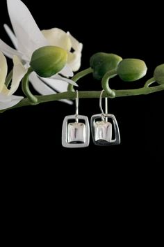 "* Beautiful drop earrings in sterling silver with a square frame * The drop is 1 1/4\" long from the top of the ear wire. * The width is 5/8\". * The weight is 6 grams of solid .925 sterling. * Highly reflective. high polish * Quality look and feel. Makes a great gift for loved ones." Silver Rectangular Everyday Earrings, Everyday Silver Rectangular Earrings, Modern Silver Rectangular Earrings, Modern Silver Earrings With Rectangular Pendant, Sterling Silver Rectangular Everyday Earrings, Modern Silver Rectangular Pendant Earrings, Everyday Sterling Silver Rectangular Earrings, Classic Rectangular Earrings For Everyday, Nickel-free Rectangular Sterling Silver Earrings