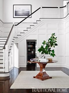 the stairs in this house are white and wood