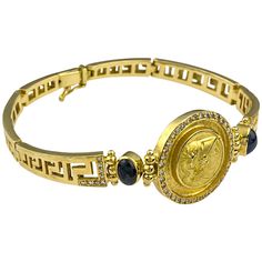 This S.Georgios designer yellow gold 18 karat Bracelet is all handmade and features a coin of the Athena (replica - a copy from the original) the Goddess of wisdom and Protector of Athens with a bezel of diamonds around it. On this art piece, we have set one Sapphire cabochon on each side of the coin the total weight of 2.45 Carats, and we have finished the band with the Greek Key design, the symbol of eternal life all the way around. The Bracelet is custom made and has brilliant cut white diamo Greek Design, Modern Bracelets, Gold Link Bracelet, Antique Bracelets, Design Bracelet, White Gold Sapphire, Jewelry Show, Rose Gold Bracelet, Gorgeous Bracelet