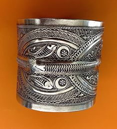 "Presenting a wonderful vintage, solid silver cuff BRACELET from Tunisia. The bracelet measures over 2 1/2\" (6,45 cm) wide and its inner diameter is 2 3/4\" (7,0 cm), though it is FULLY ADJUSTABLE. The bracelet features wonderfully textured floral and geometric designs. It has Tunisian and Libyan hallmarks for 800 silver. This piece is also an excellent size for a man's wrist." 3d Shape, African Jewelry, Wide Cuff, Silver Cuff Bracelet, Coin Pendant, Tunisia, Silver Cuff, Geometric Designs, Textures Patterns