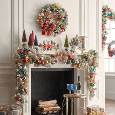 a fireplace decorated with christmas ornaments and wreaths