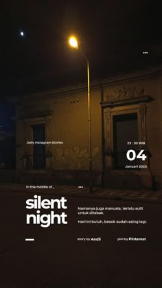 an advertisement for silent night on the side of a building at night with street lights