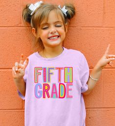 Your little one is sure to love this super cute Back to School Shirt! Perfect for her first day back or meet the teacher! Made with our best selling Comfort Colors brand - now in kids sizes!! Woo hoo! SIZE UP 1-2 SIZES FOR THAT OVERSIZED LOOK   Thanks so much for shopping with me! Please message me with any questions you may have! I am always available to help :) Also, I would love to feature you on our insta if you want to tag me @poppyroseclothing    PRODUCTION TIME: 1-3 business days    SHIPPING TIME: 2-5 business days   PRODUCT DESCRIPTION: Comfort Colors Midweight Tee Created to fit in any kid's active schedule, these kid's tee shirts pack both comfort and agility. Made 100% with combed ring-spun cotton for total comfort whether it's studying or playing time. The fabric is soft-washed Fun Pink T-shirt For School Events, Cute Letter Print Tops For School Events, Fun Pink T-shirt For End Of School Year, Cute Crew Neck Shirt For End Of School Year, Pink Shirt For Back To School, Pink Short Sleeve T-shirt For Daycare, Cute Tops For Birthday And Back To School, Fun Pink School Shirt, Fun Pink Shirt For School