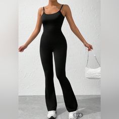 Never Worn. Adjustable Straps. Excellent Condition. Elastic Material Casual Black Jumpsuits And Rompers For Gym, Trendy Black Bodysuit For Workout, Trendy Black Workout Bodysuit, Casual Black Elastane Bodysuit, Chic Black Jumpsuits And Rompers For Workout, Chic Black Workout Jumpsuits And Rompers, Black Non-stretch Trendy Jumpsuits And Rompers, Trendy Black Non-stretch Jumpsuits, Flare Leg Jumpsuit