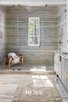 a bathroom with an area rug on the floor