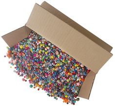 a cardboard box filled with lots of colorful beads