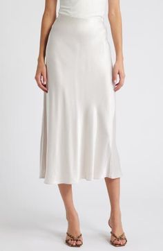 Put some slink in your step in this solid satin midi skirt fitted with a concealed-elastic waistband to help you move through your day with ease. 32" length (size Medium) Concealed-elastic waist Unlined 55% rayon, 45% viscose Dry clean Imported White Formal Midi Bottoms, Elegant Midi Skirt For Daywear, Elegant Daywear Skirt, Elegant Skirt For Daywear, Elegant Cream Skirt For Daywear, Elegant Skirt Bottoms For Daywear, White Midi-length Bottoms For Evening, White Midi Length Bottoms For Evening, Feminine Formal Midi-length Bottoms