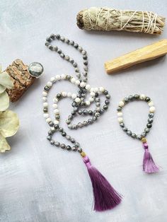 This mala necklace is made with 108 natural stone beads of magic labradorite and white howlite adorned with silver beads. This prayer garland  is the perfect support garland for counting mantras during your practices. Its a 108 knotted beads mala, very light weight, an spiritual sacred jewelry for chakra healing. I make each mala by hand, knotting each of the 108 beads with great care and I made every single silky and delicate tassel. I use a very resistant braided macrame rope, achieving a mala that lasts over time. All our malas are very versatile, since you can use them on many occasions. This prayer garland has two beads size:  - small 6mm.  50 cm / 20 inch - large 8mm. 64 cm / 25 inch Spiritual Stone jewels choose personally every single gemstone for her prayer garlands, to ensure his Handmade Howlite Spiritual Jewelry, Handmade Spiritual Howlite Jewelry, Spiritual White Jewelry For Meditation, White Labradorite Bohemian Necklace, Bohemian White Labradorite Necklace, Bohemian Howlite Jewelry For Healing, Labradorite Bead Jewelry As A Gift, Spiritual Labradorite Crystal Necklaces For Meditation, Gray Spiritual Jewelry With Gemstone Beads