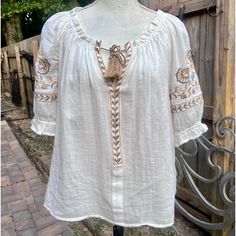 Lovely Peasant Blouse With Elastic Neck And At Bottom Of Sleeves Embroidered Imported Nwt! Measurements: 20”L 19”Armpit To Armpit Size Medium Beige Peasant Top For Vacation, Peasant Style Embroidered Top For Vacation, Peasant Style Embroidered Top For Beach, Cream Embroidered Peasant Blouse, Fall Peasant Top With Short Sleeves, Fall Short Sleeve Peasant Top, White Linen Peasant Top For Summer, Casual Embroidered Beige Peasant Top, Casual Beige Embroidered Peasant Top